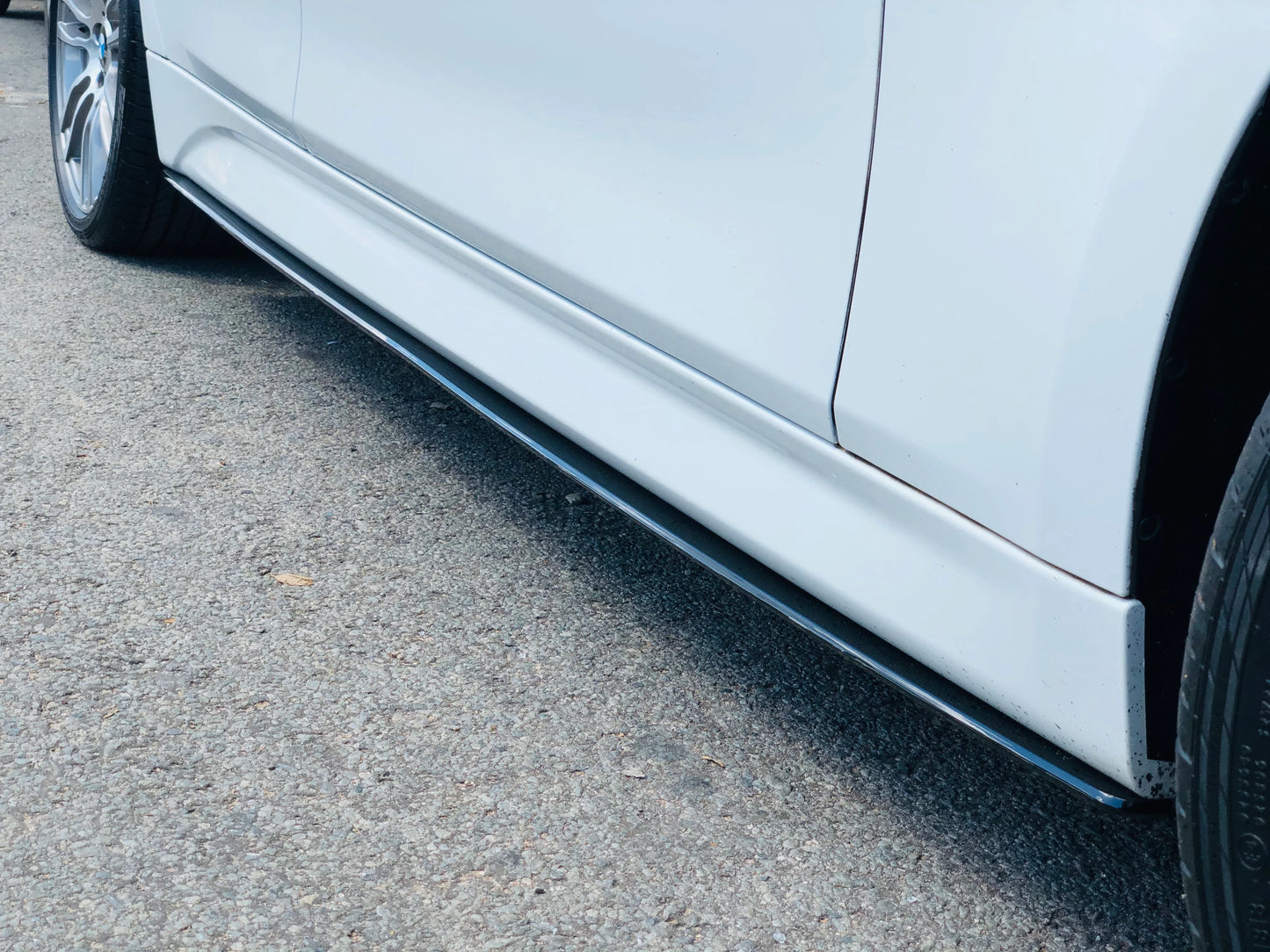 Gloss Black Performance Side skirt extension spoilers for BMW F30, F31 models.